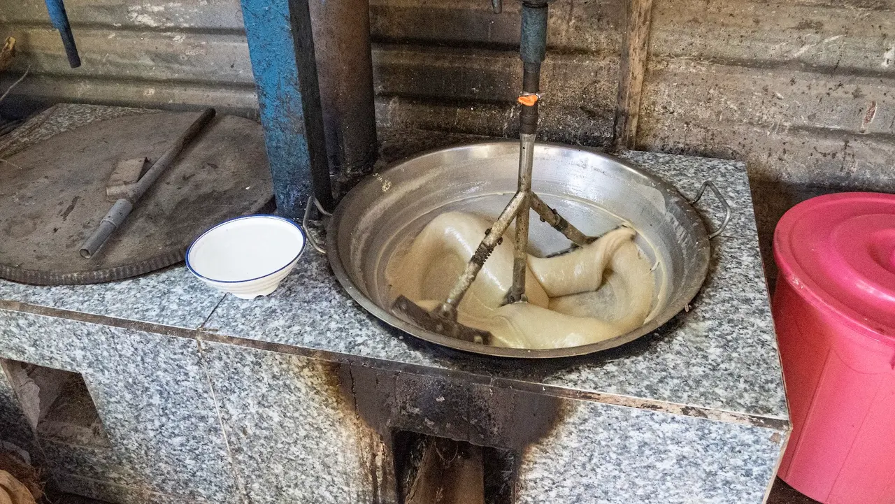 Coconut candy cooking in a workshop pan